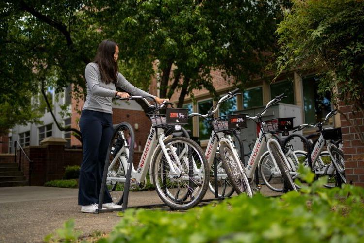 a student selects an e-bike from the on-campus hub
